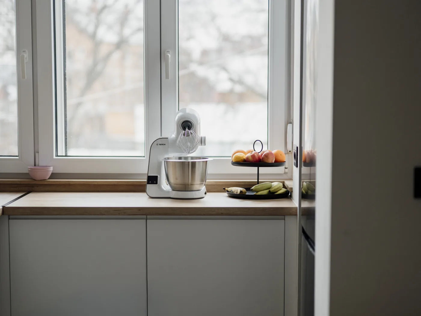 Clean kitchen counter detail with small appliances by a bright window