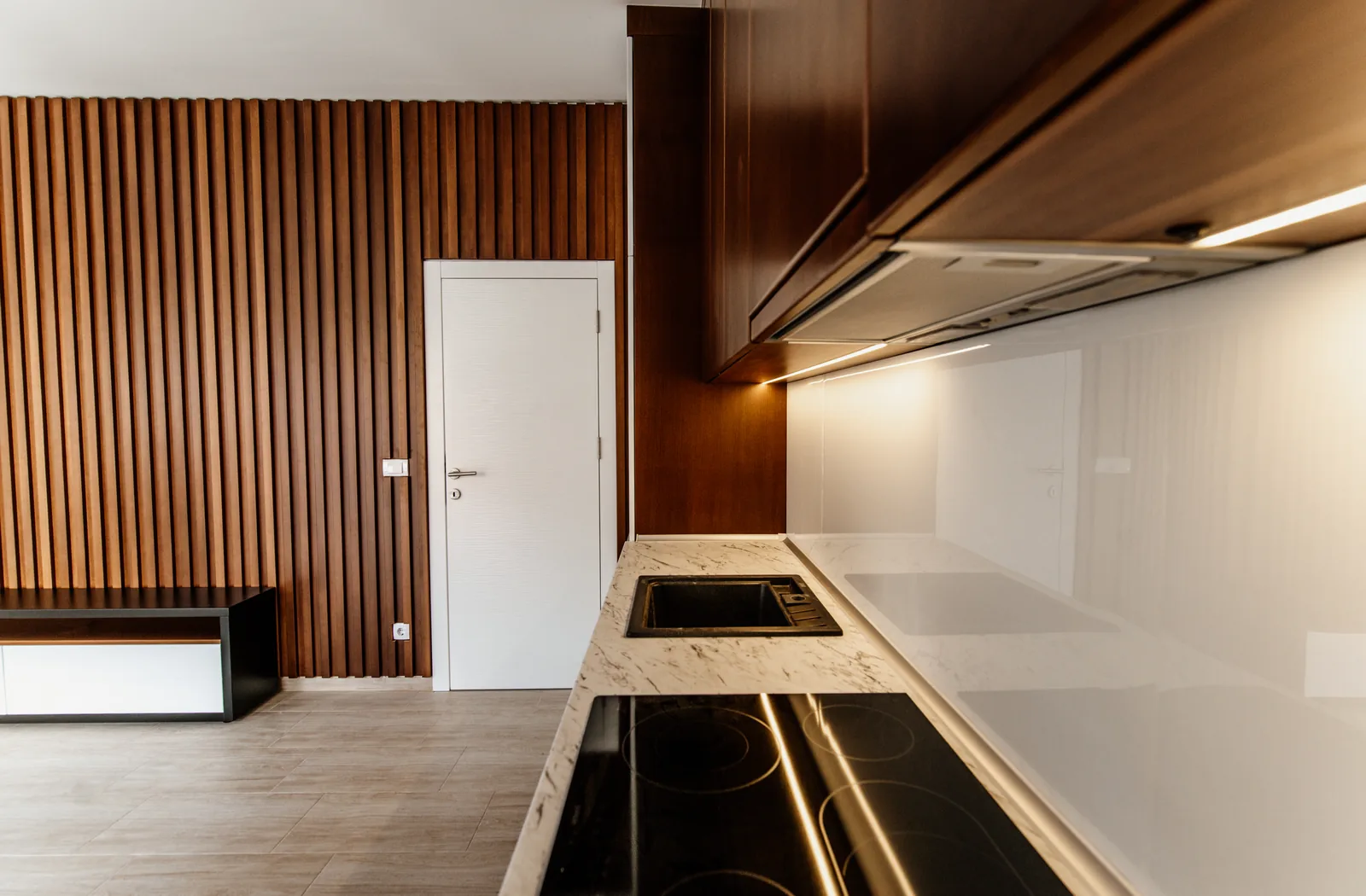 Modern domestic kitchen and living area kept clean and orderly